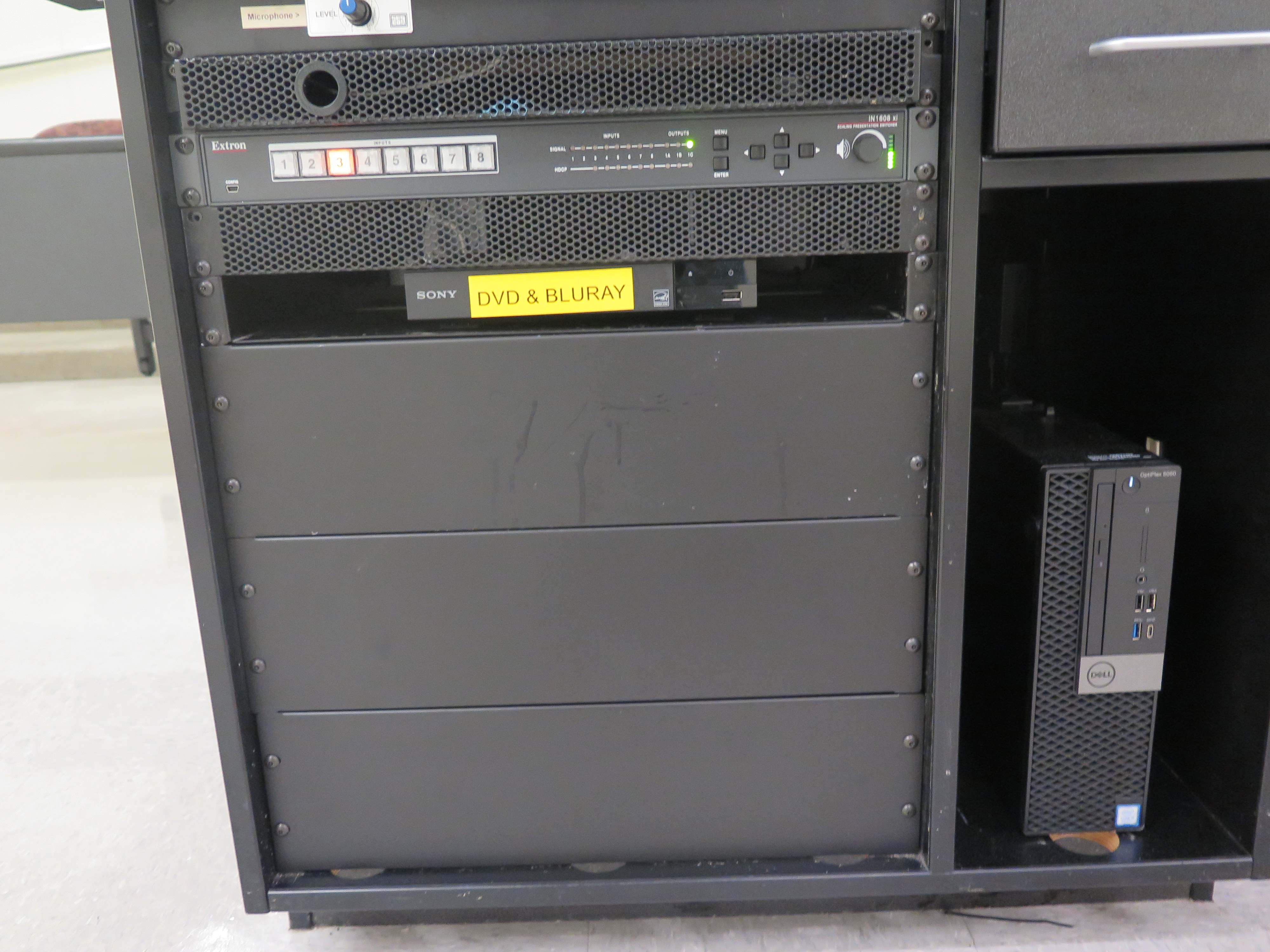 Front of equipment rack showing AV switcher, below that is Blue-Ray/DVD player, to the right is the Dell computer CPU.