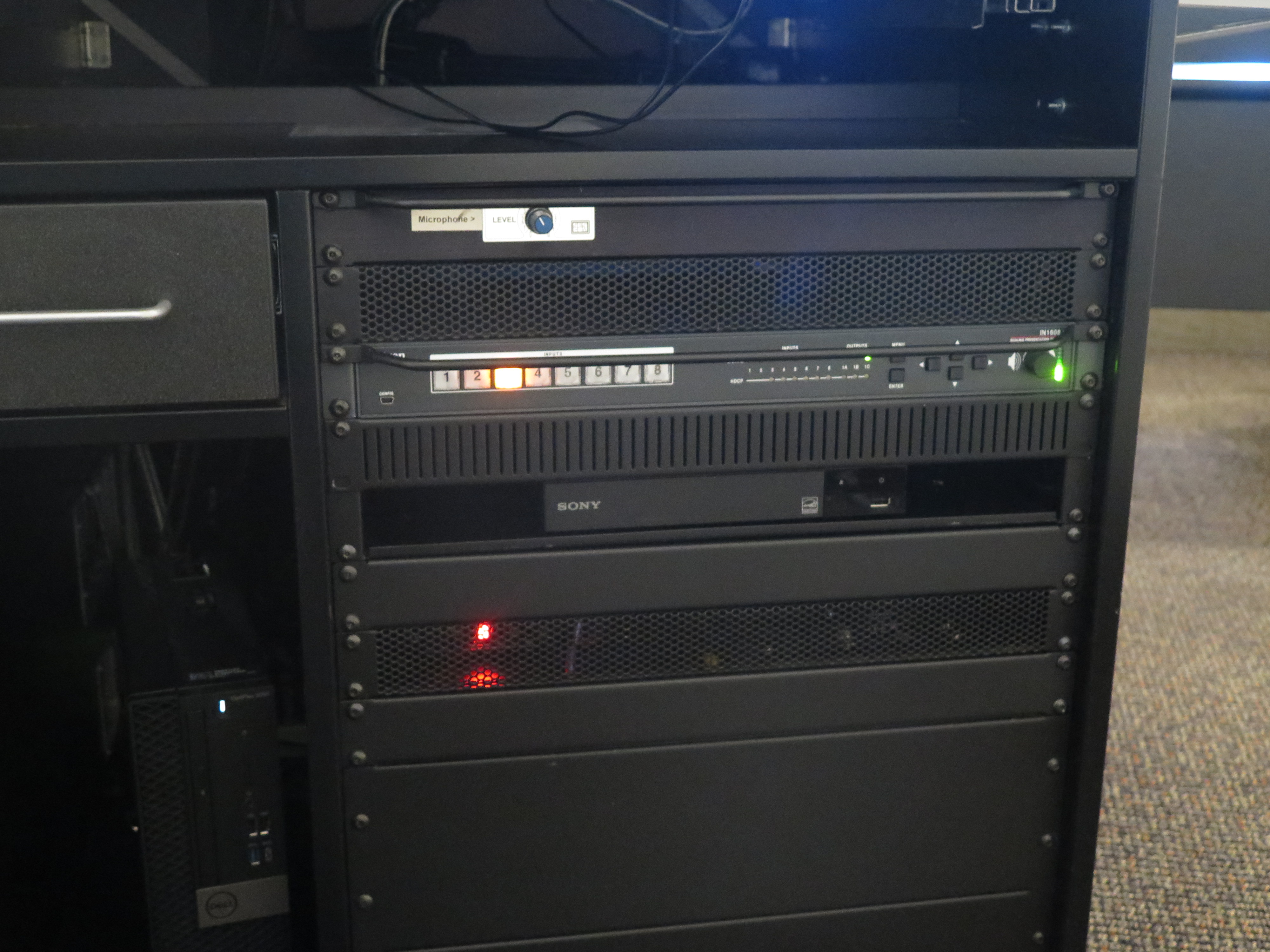 Front of equipment rack showing AV switcher, below that is Blue-Ray/DVD player, to the left is the Dell computer CPU.