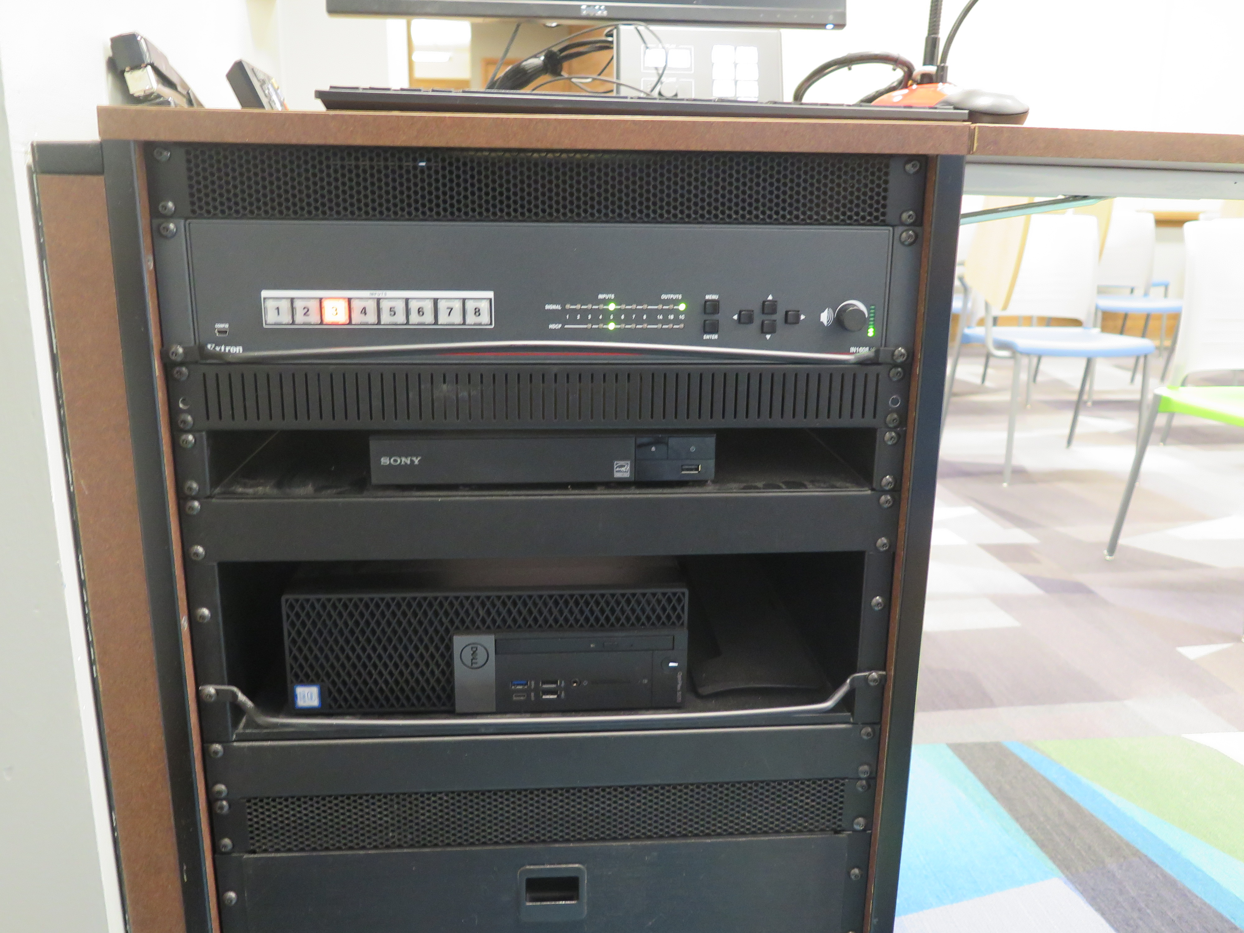 Front of Equipment rack showing AV Switcher. Below that is Blue-Ray/DVD Player. On the bottom is the the Dell Computer CPU.