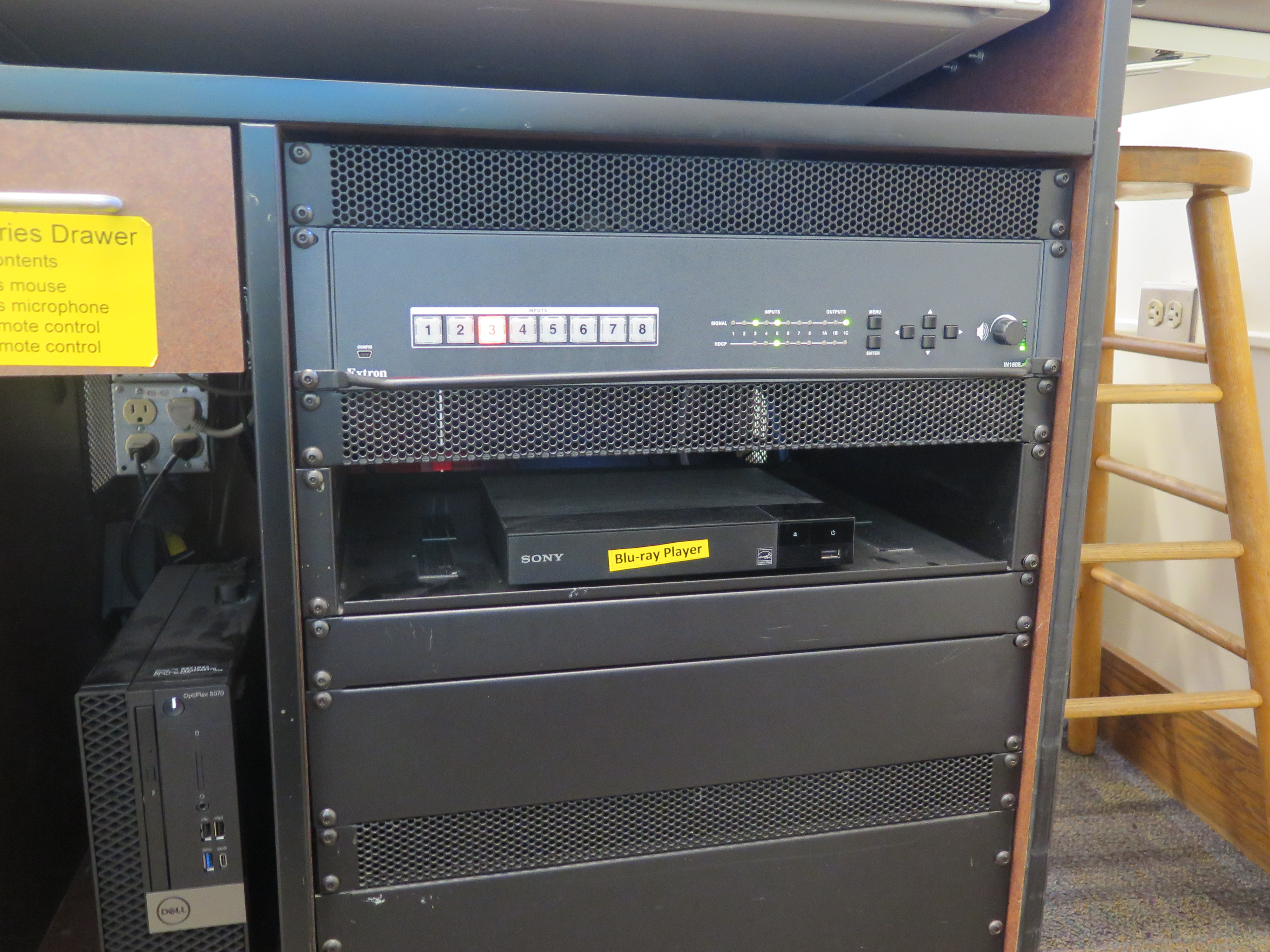 Display rack consists of a AV controller, Blu-Ray/DVD player and Dell Computer