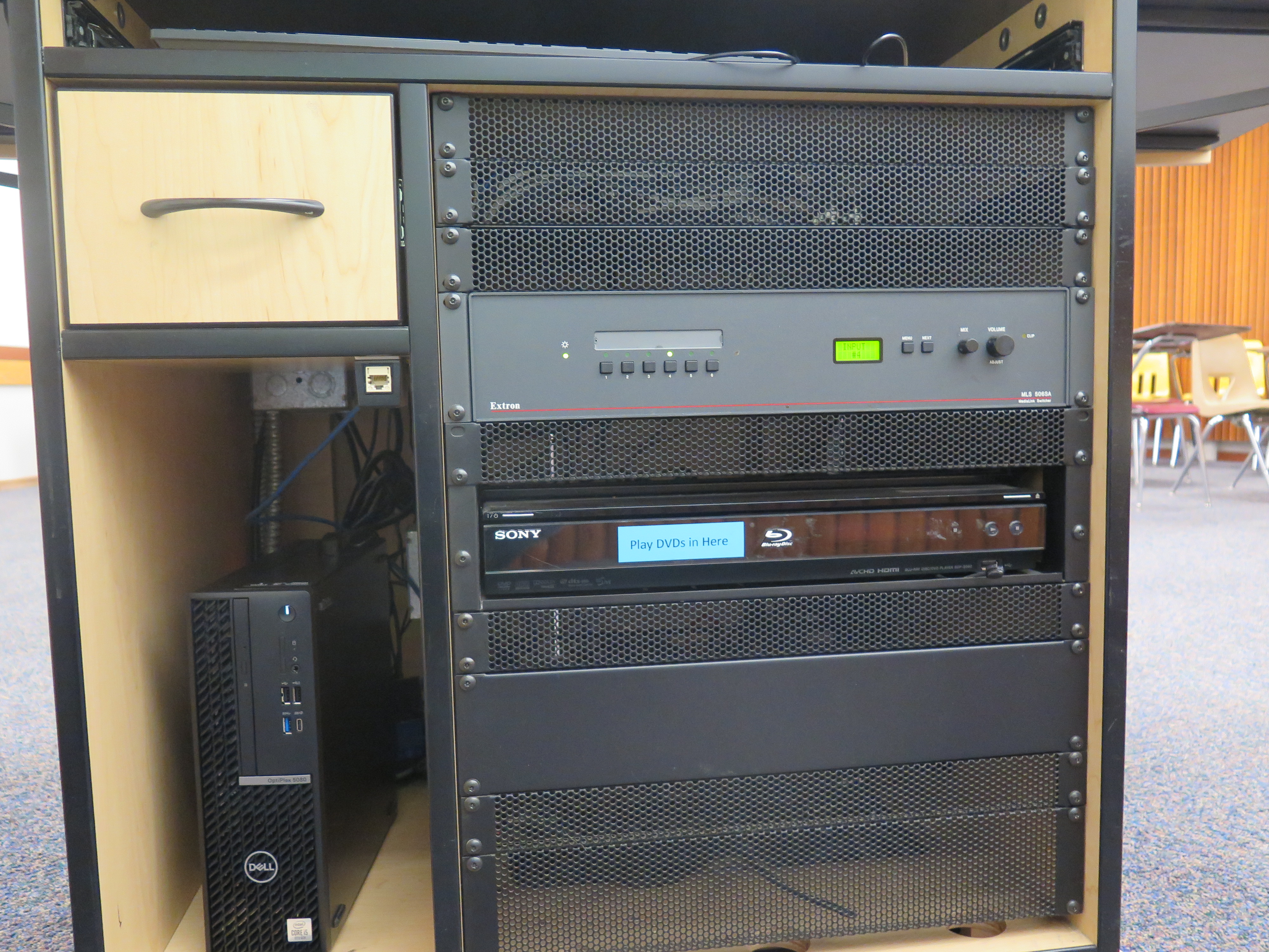 Display rack consists of a AV controller, Blu-Ray/DVD player and Dell Computer CPU.