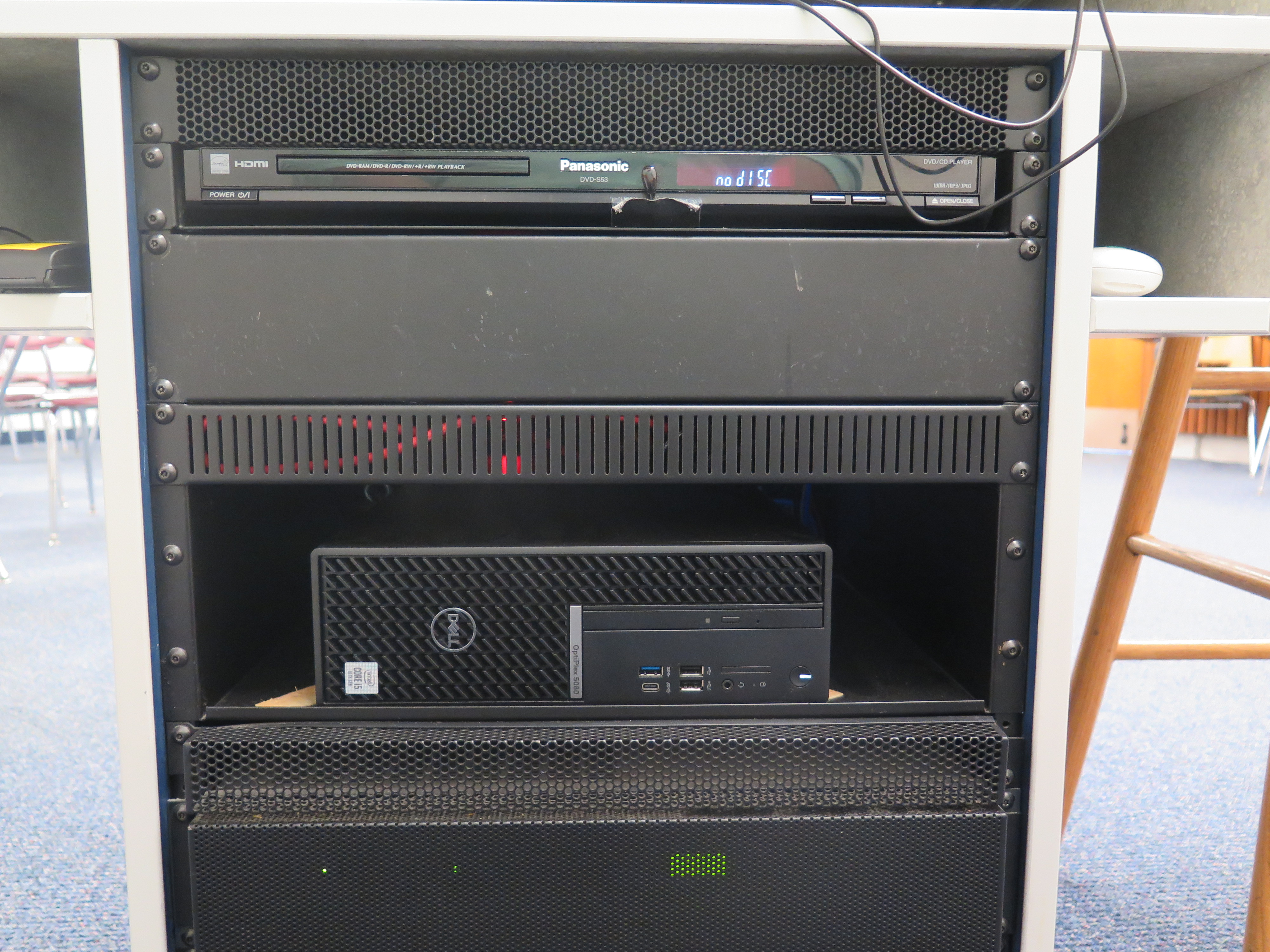 Display rack consists of a DVD player and Dell Computer CPU.