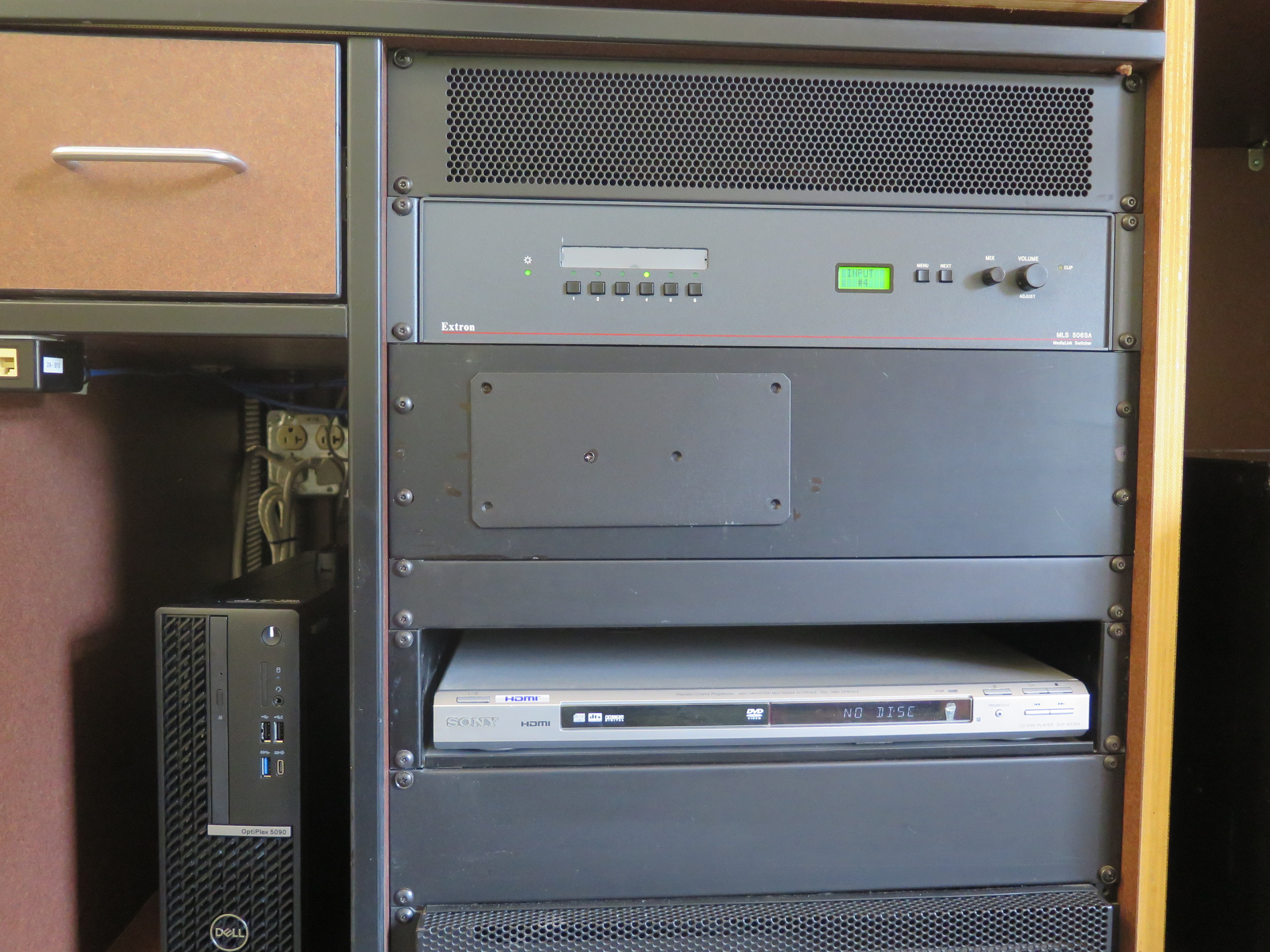 Front of Equipment rack showing AV Switcher. Below that is the DVD Player. To the left is the compartment with the Dell Computer CPU.