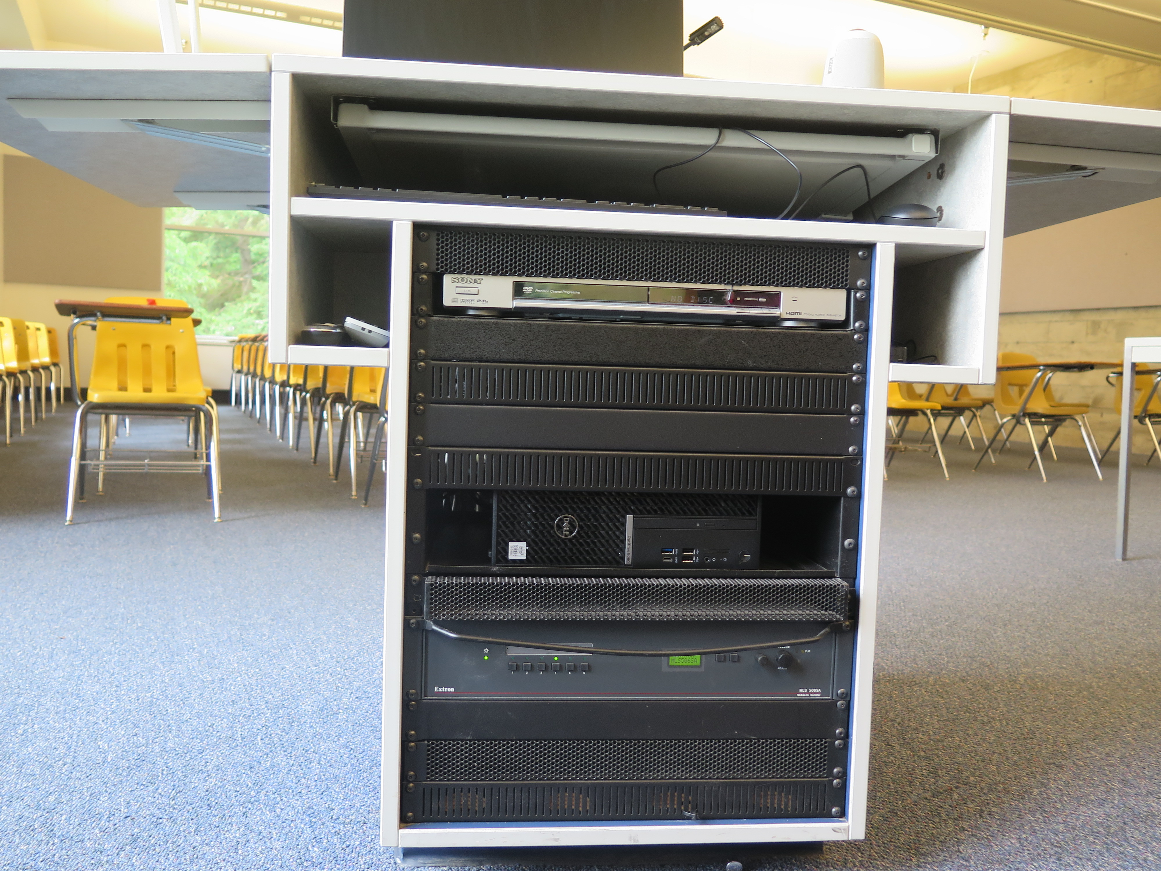 Display rack consists of a DVD player, a Dell Computer CPU, and a Extron switcher.