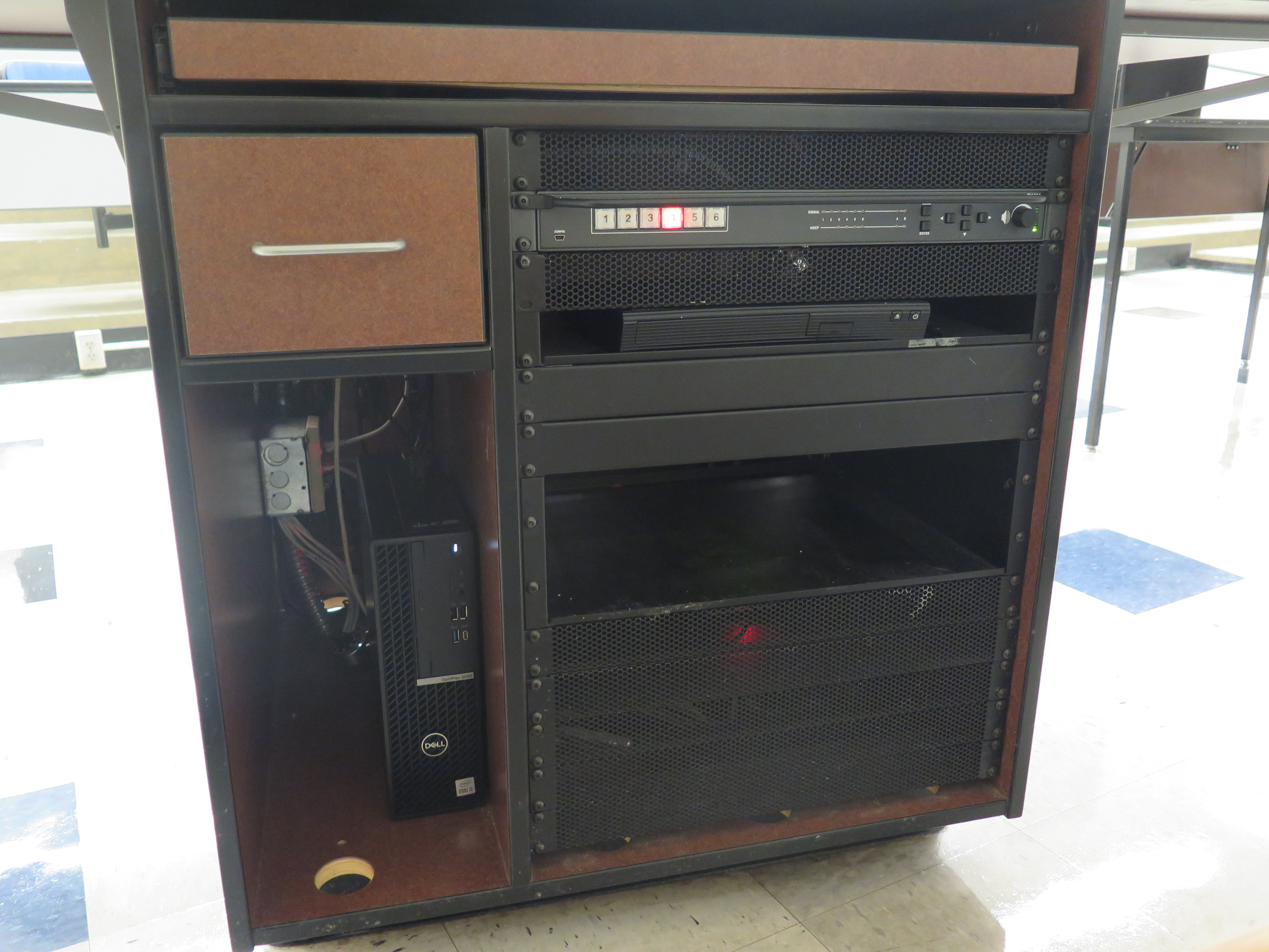 Front of Equipment rack showing AV Switcher. Below that is the DVD Player. To the left is the compartment with the Dell Computer CPU.