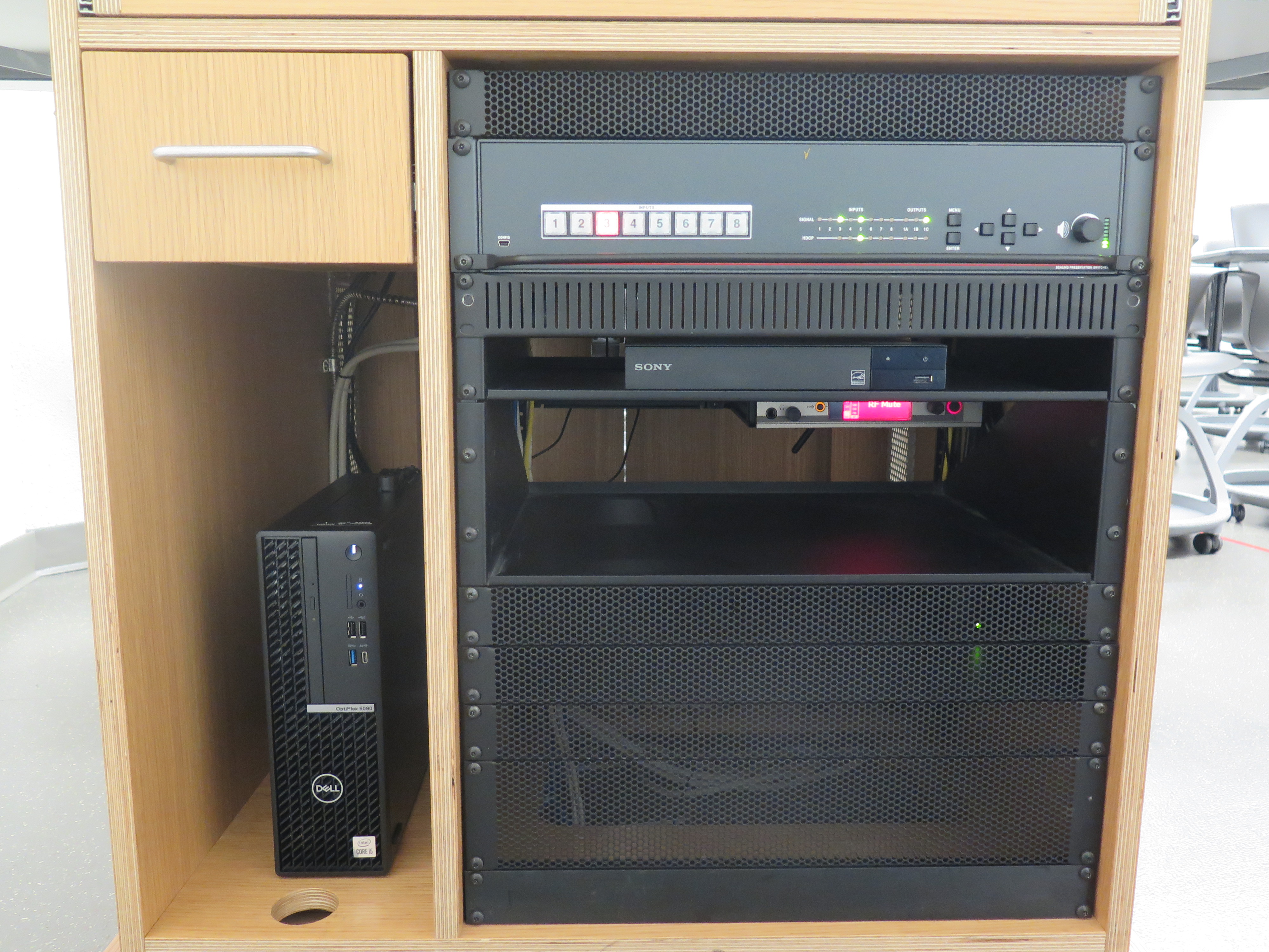 Equipment rack consists of AV Switcher, DVD Player and Dell Computer CPU.