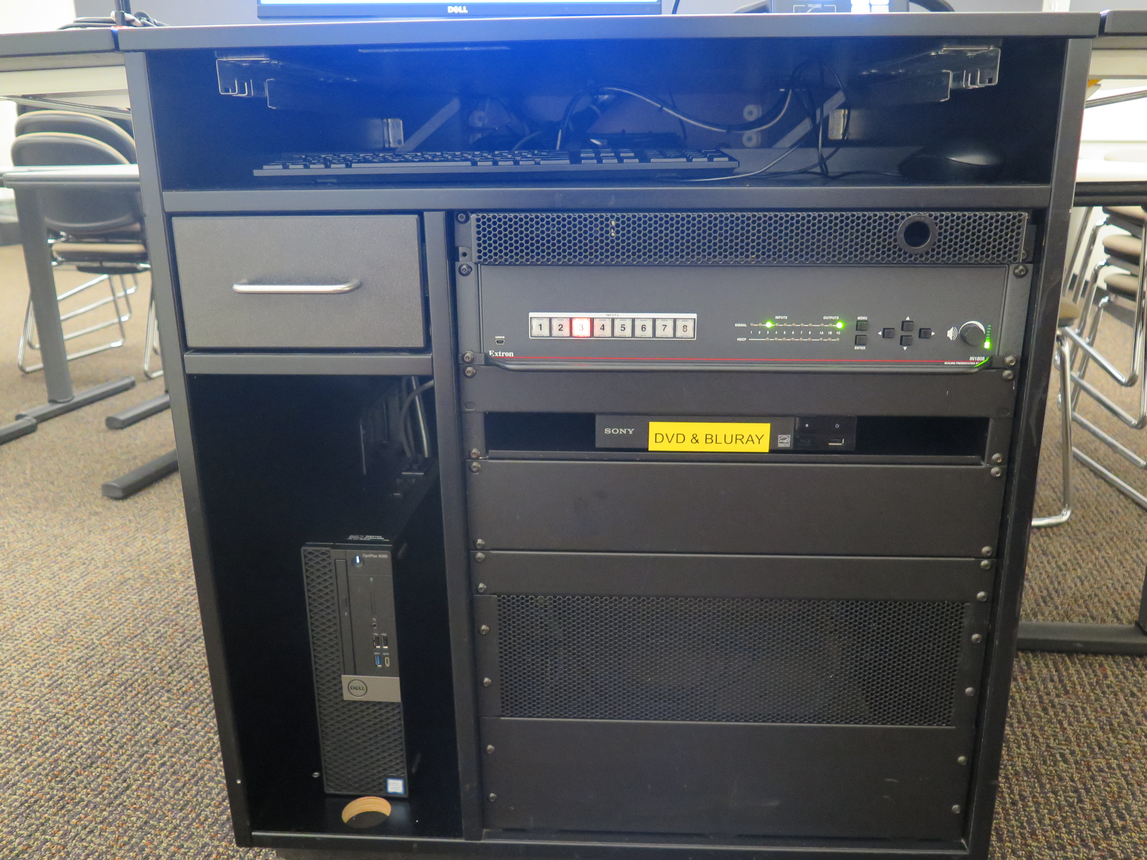 Front of Equipment rack showing AV Switcher. Below that is Blue-Ray/DVD Player. To the left is the the Dell Computer CPU.