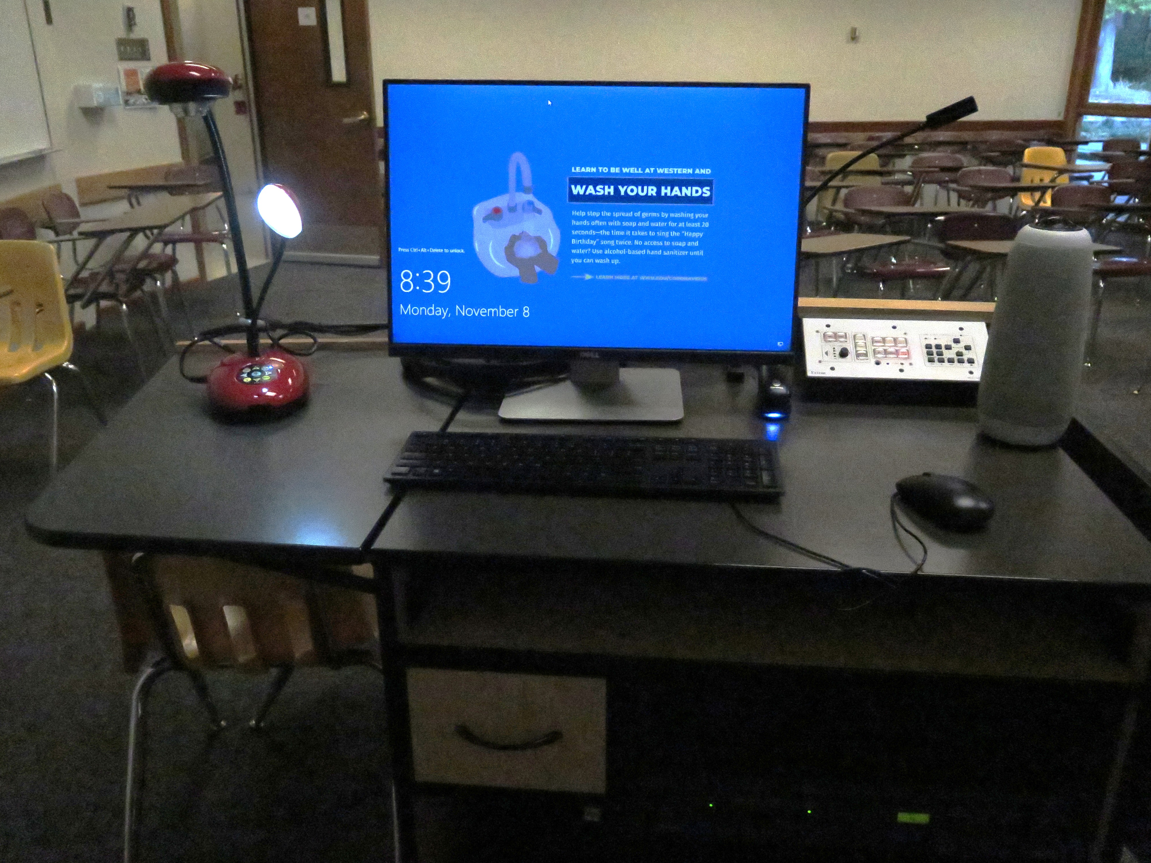 Top of the podium has a Lumens Ladybug document camera, Dell PC Monitor, AV push button Controller, and an Owl Camera