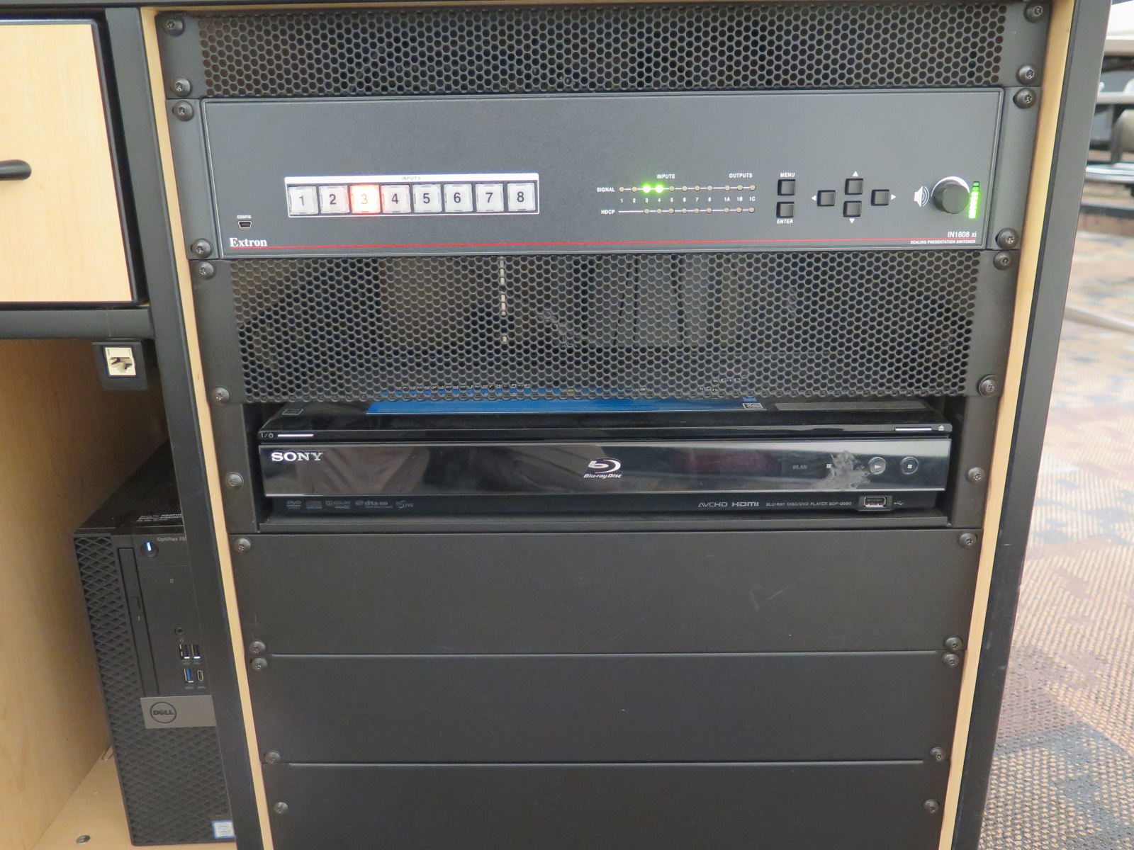 front of podium showing switcher and BLU-Ray player