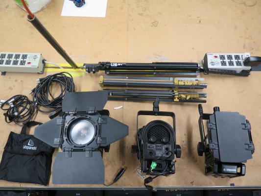 The third image shows what comes in the Sola Light kit bag. This includes the three lights that each have their own set of barn doors, three light stands, power cables and gel light filters 